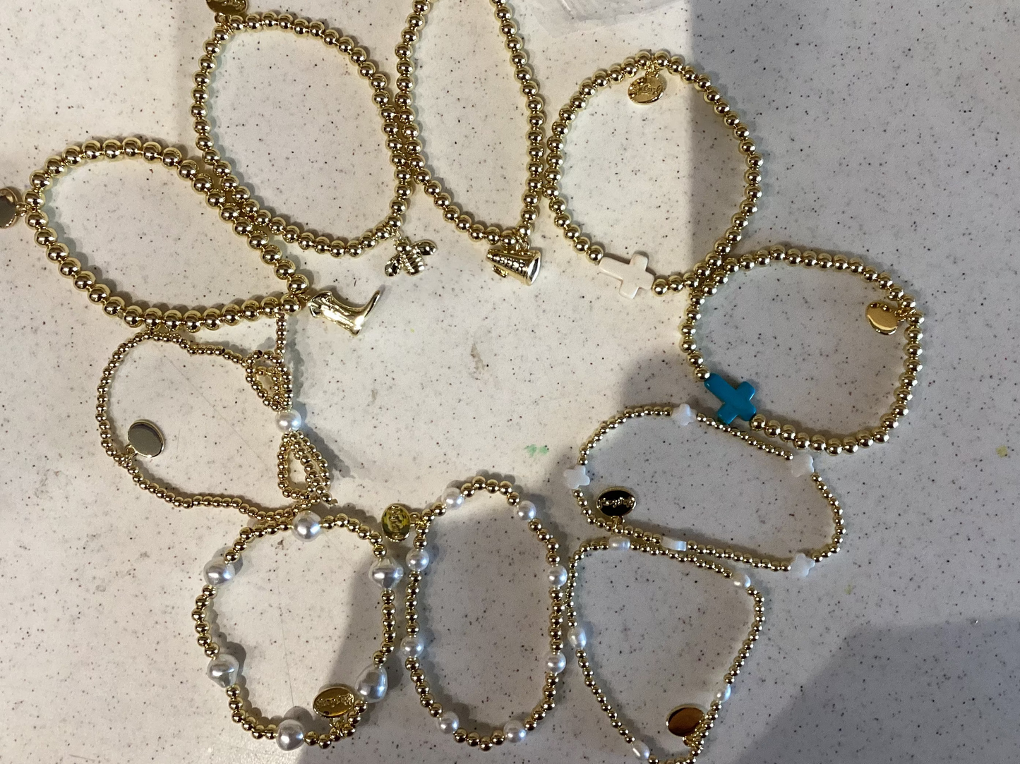 Alex Carol Pearl, Charm, Cross